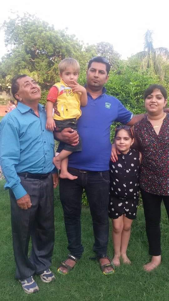 Dheeraj with his family before he started cycling. 